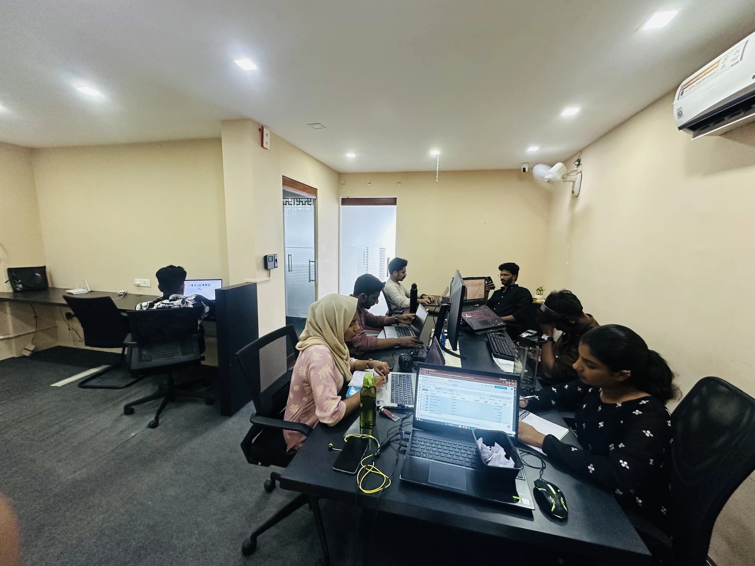 Team working at their desks in the Bdot office