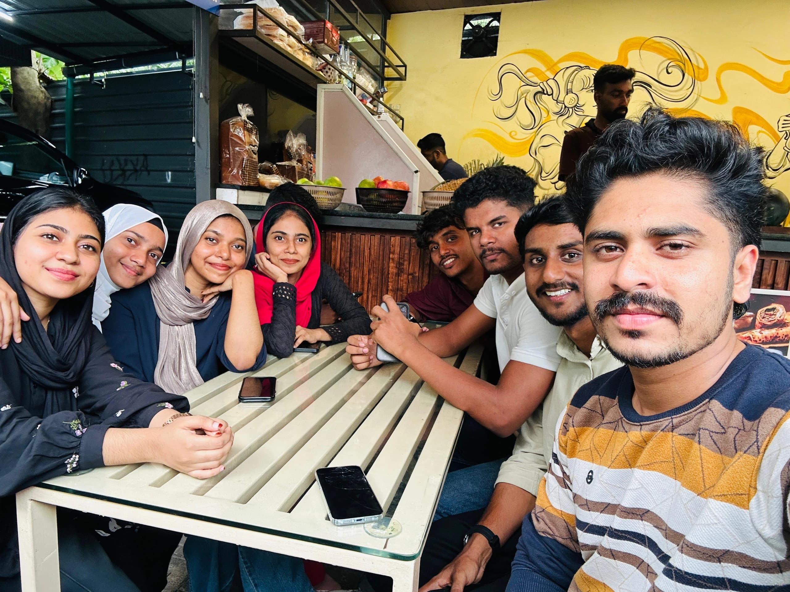 Bdot students and mentors at a cafe get-together