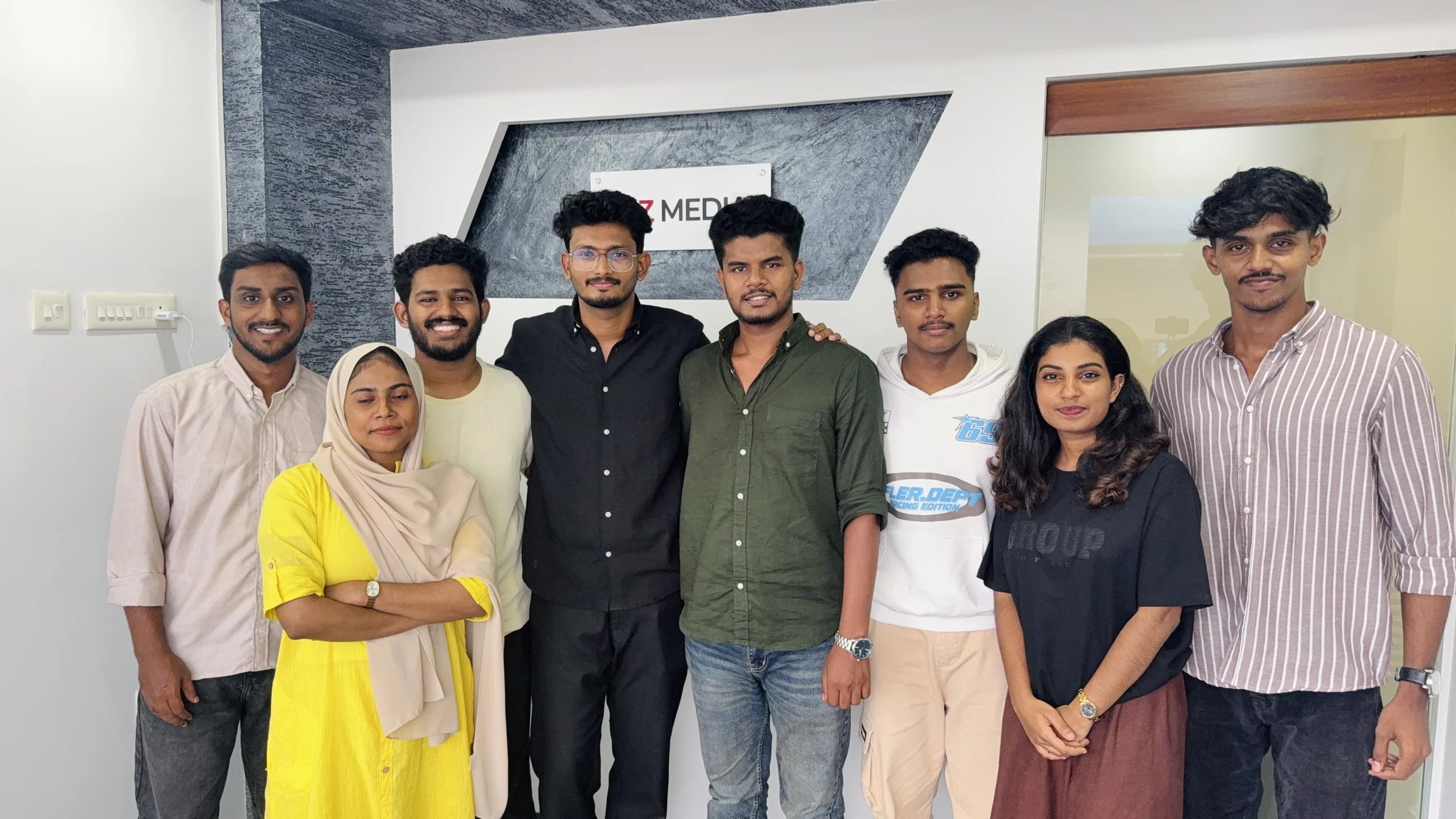 The Bdot team and mentors posing together in the office